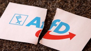 Das Logo der Bremer AfD mit einem Riss darin. (Symbolfoto)