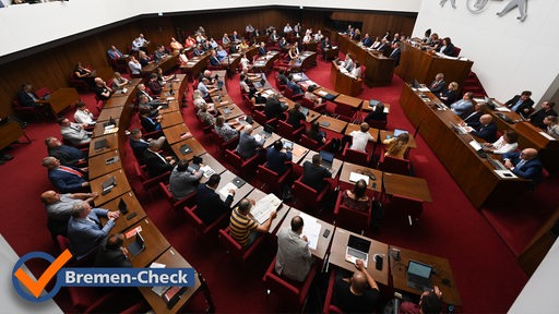 "Bremen-Check"-Logo vor dem Foto mit Blick auf eine Sitzung der Bremischen Bürgerschaft