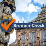 "Bremen-Check"-Logo vor dem Bremer Roland und Bremer Rathaus