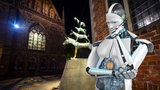 Collage zeigt einen nachdenklichen Roboter neben den Bremer Stadtmusikanten