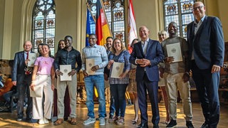 Einbürgerungsfeier in der oberen Rathaushalle mit Bürgermeister Bovenschulte, Olaf Scholz und den Neubürgern