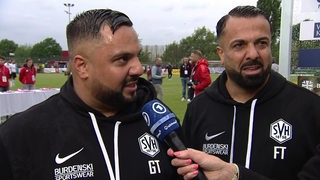 Hemelingens Trainer Günter und Feyhat Tuncel im ARD-Interview