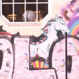 Ein Graffiti mit einem Einhorn.