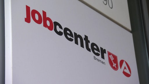 Ein Schild mit dem Logo des Jobcenters.