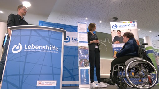 Ein Messestand der Lebenshilfe während der Beratung. 