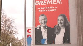 Ein CDU-Plakat auf dem Frank Imhoff und Wiebke Winter abgebildet sind