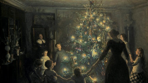 Gemälde "Glade jul" by Viggo Johansen von 1891: Eine Familie tanzt um ihren Weihnachtsbaum
