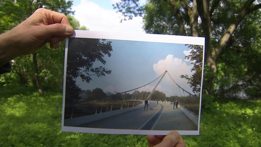 Auf einem Blattpapier ist ein Entwurf der neuen Weserbrücke zu sehen.
